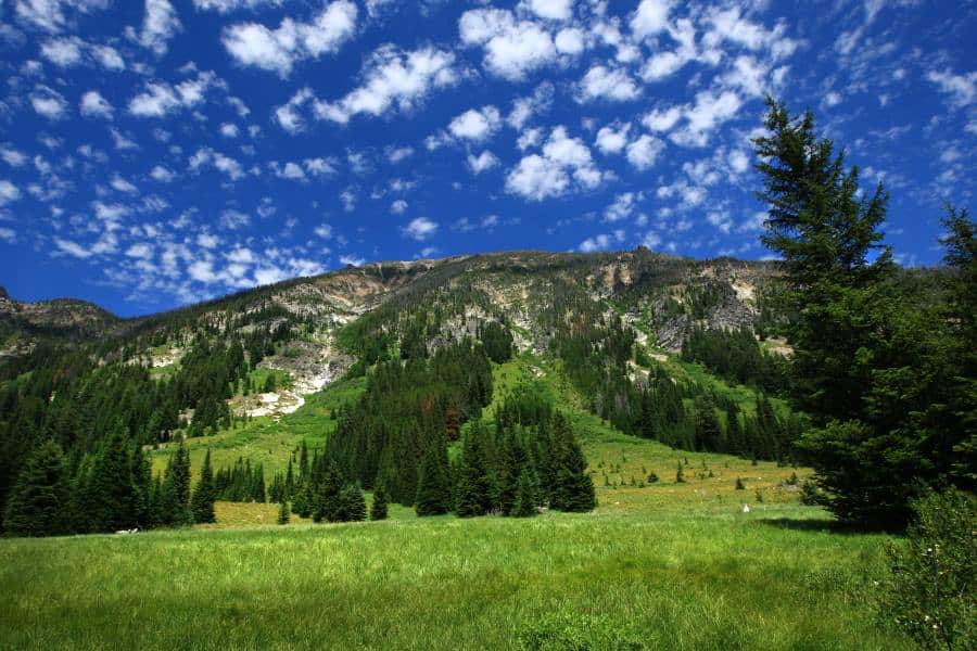 spotted clouds over a montana mountain range