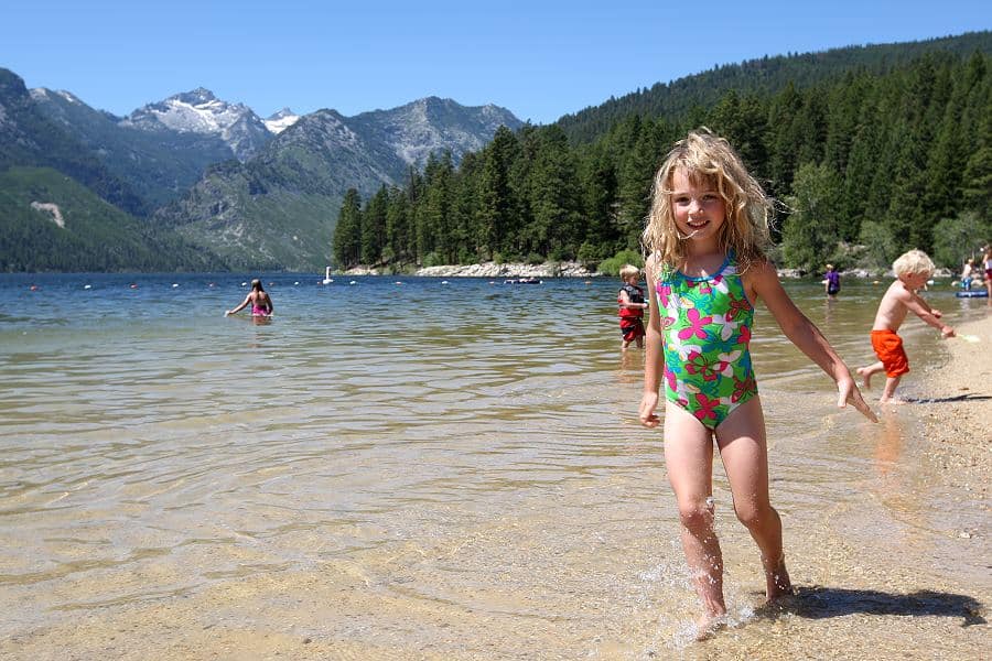 image of children playing on lake como beach