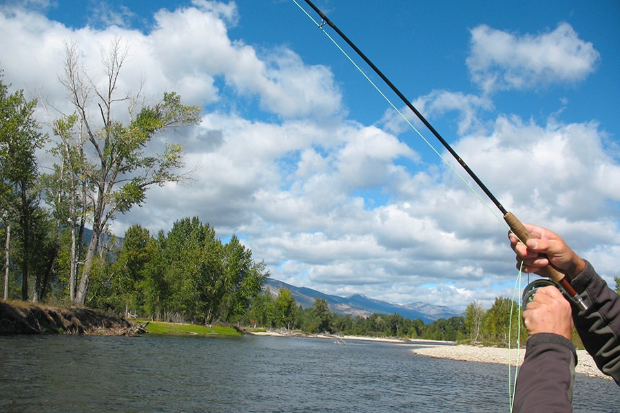 image of a fly fishing rod and the bitterroot river