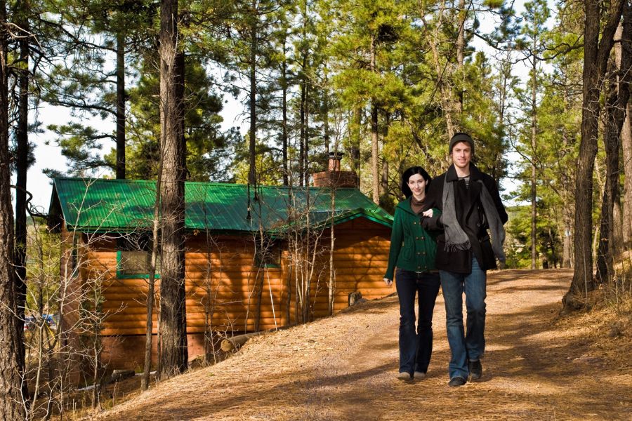 couple walking by cabin